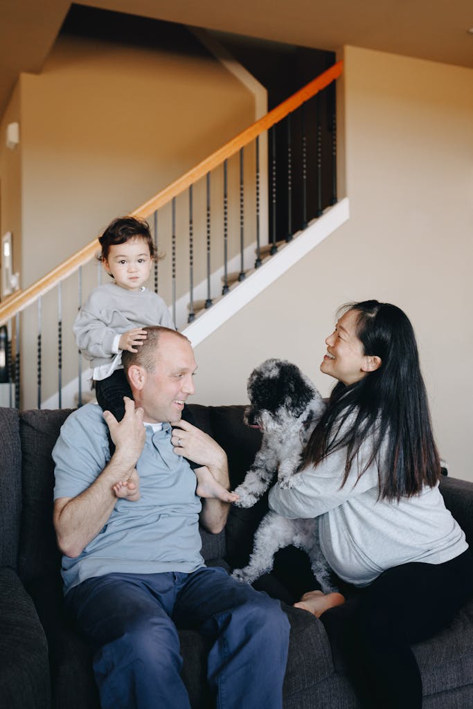 A family with a child and dog bonding in their cozy home interior.